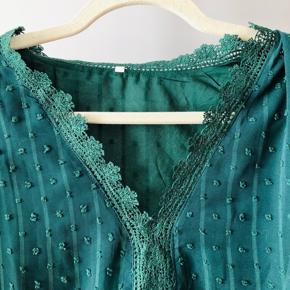 Green v-neck blouse with flowy sleeves